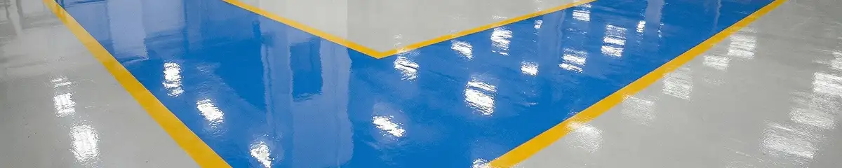 A factory floor professionally covered and marked with epoxy flooring in Wichita, KS