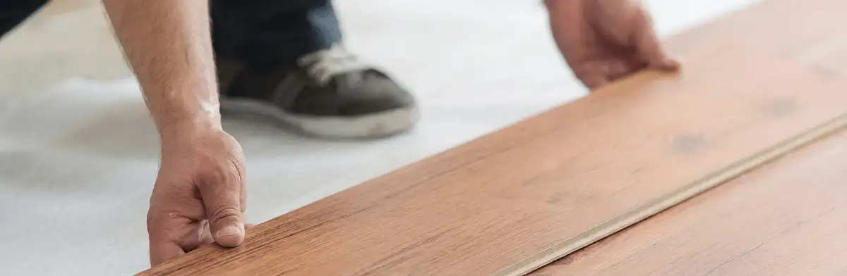 A professional installing laminate flooring in Wichita, KS