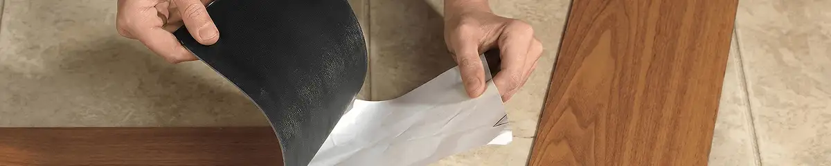 A professional installing vinyl flooring in Wichita, KS