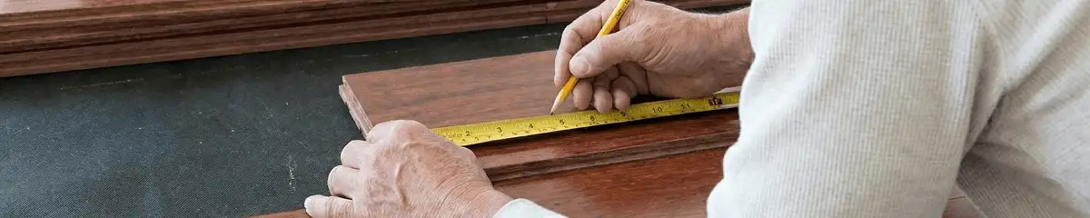 A professional installing wood flooring in Wichita, KS
