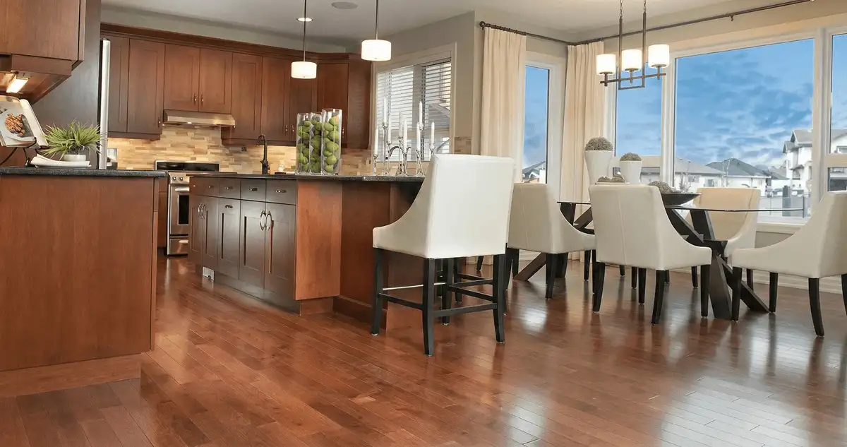 A modern kitchen with professionally installed wood flooring in Wichita, KS